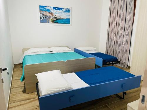 Łóżko lub łóżka w pokoju w obiekcie Eloro casa vacanza