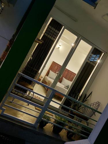 a view of a stairway with a glass window at CHEN VILLA - Near Airport in Negombo