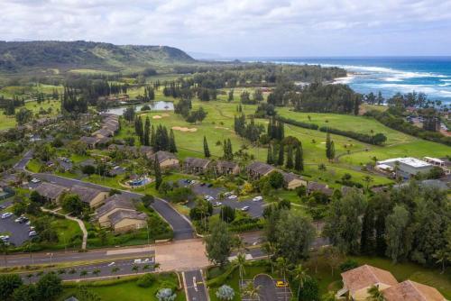 an aerial view of a resort near the ocean at Fantastic Location on the golf course near the beach in Kahuku