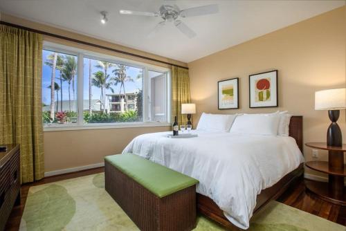 a bedroom with a large bed and a window at Glorious Beachfront high end Villa in Kahuku