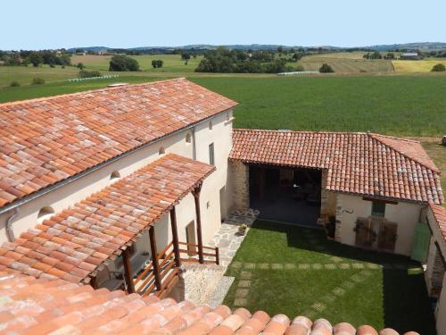 an overhead view of a building with red tile roofs at Le manse des janades in Rosières