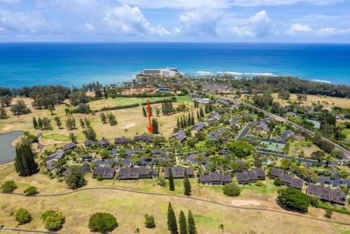 an aerial view of a resort near the ocean at Beach Glam at Turtle Bay on the golf course in Kahuku