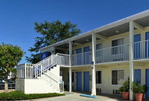 a building with a staircase in front of it at Americas Best Value Inn Bradenton-Sarasota in Bradenton