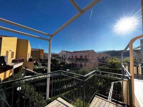 a balcony with a view of a city at Casa Vacanze Isabella in Campofelice di Roccella
