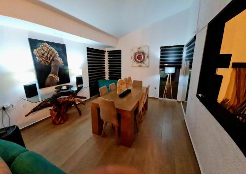 a living room with a table and a dining room at Villa Gala in Balíon