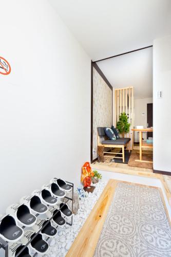 a living room with a couch and a table at Osaka Family Villa with Free Parking near Namba in Osaka