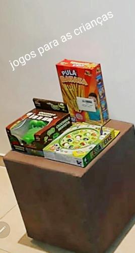 a pile of games on top of a table at StudioRD Copacabana 250m da praia esquina com a Rua do Copacabana Palace Rodolfo Dantas in Rio de Janeiro