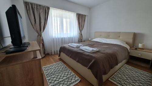 Ένα ή περισσότερα κρεβάτια σε δωμάτιο στο VS Central apartment