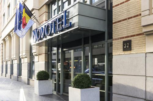a building with a sign for a hotel at Novotel Brussels City Centre in Brussels