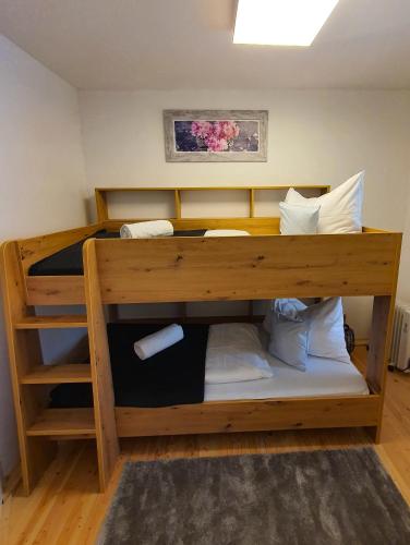 a bunk bed in a small room with at Kozma Apartments Peterlewand Gerlitzen Ossiachersee in Bodensdorf