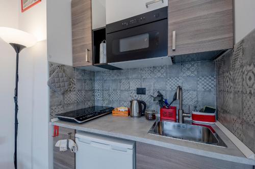 Dapur atau dapur kecil di Il Gattino di Torino - Monolocale centro e ospedali