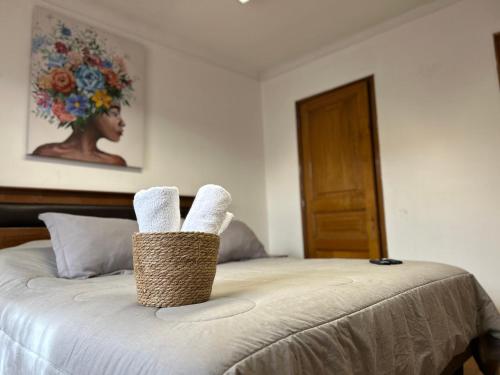a bedroom with a bed with towels on it at Casona Lorena in Santiago
