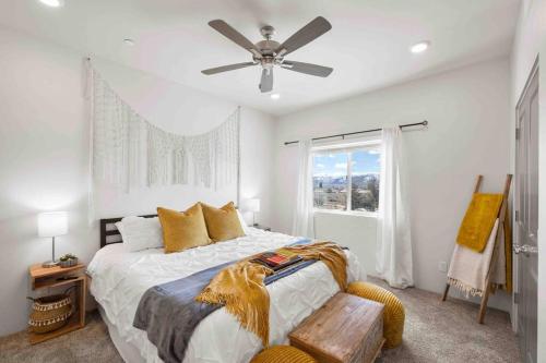 a bedroom with a bed and a ceiling fan at The True Badger Honey House in Ephraim