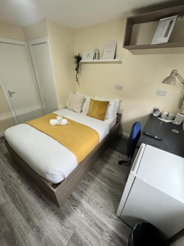 a bedroom with a bed with a stuffed animal on it at west walk house in Nottingham