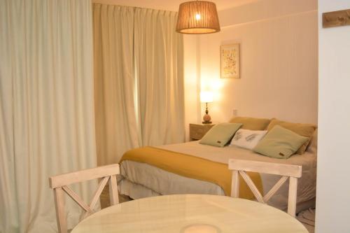 Ένα ή περισσότερα κρεβάτια σε δωμάτιο στο Suites Salta