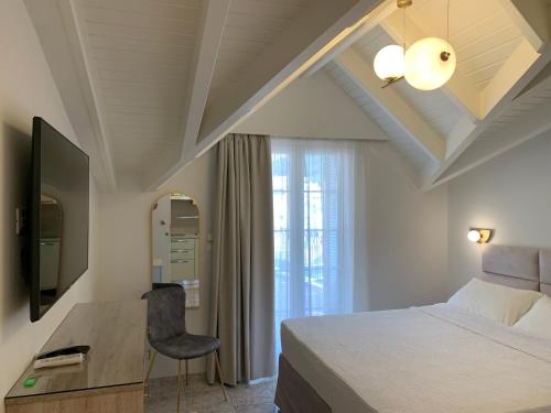 Μια τηλεόραση ή/και κέντρο ψυχαγωγίας στο Rouchotas Apartments