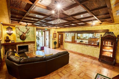 a living room with a couch and a fireplace at Coto del Valle de Cazorla in Cazorla