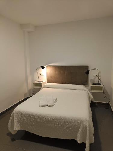 Katil atau katil-katil dalam bilik di Hostal La Ermita