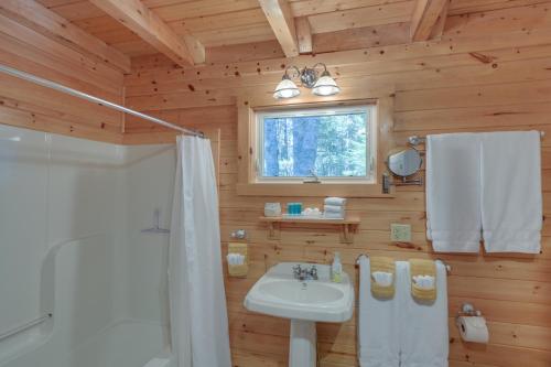 a bathroom with a white sink and a shower at Maine Lodging Near Acadia National Park! in Bernard
