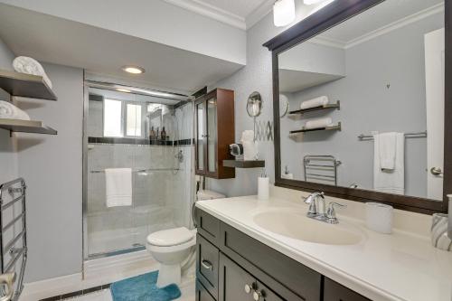 a bathroom with a toilet and a sink and a shower at Waterfront Galveston Bay Retreat - 4 Mi to Beach! in Galveston