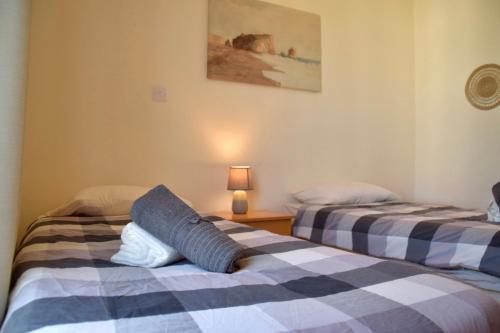 two beds sitting next to each other in a room at Pervolina countryside by the sea in Pervolia