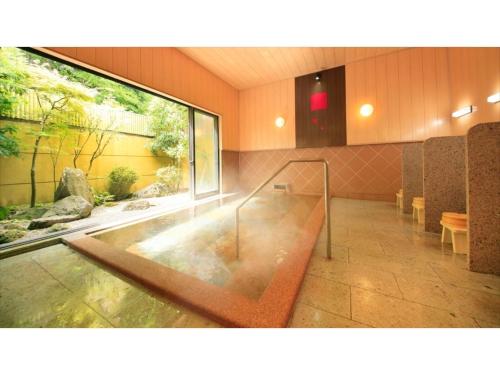 a lobby with an aquarium in a building at Saikatei Jidaiya - Vacation STAY 96429v in Kaminoyama