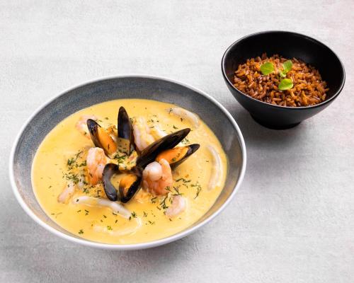 a bowl of shrimp and rice and a bowl of food at Hyatt Place Bogota Convention Center in Bogotá
