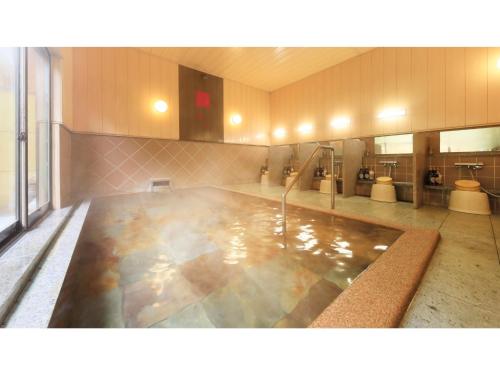 a large swimming pool in a large room at Saikatei Jidaiya - Vacation STAY 96452v in Kaminoyama