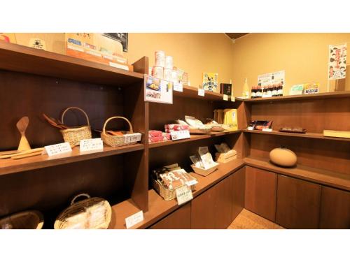 a store with shelves with baskets and other items at Saikatei Jidaiya - Vacation STAY 96439v in Kaminoyama