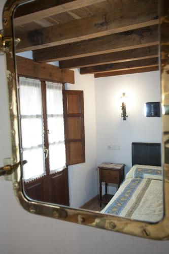 Ένα ή περισσότερα κρεβάτια σε δωμάτιο στο El Cabañon de Pimiango
