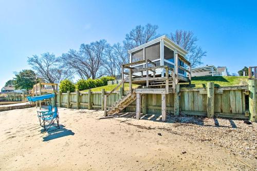 a lifeguard tower sitting on top of a wooden fence at Refreshing Colonial Beach Vacation Rental! in Colonial Beach