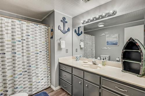 a bathroom with a sink and a shower at Full Moon Harbor in Horseshoe Bay