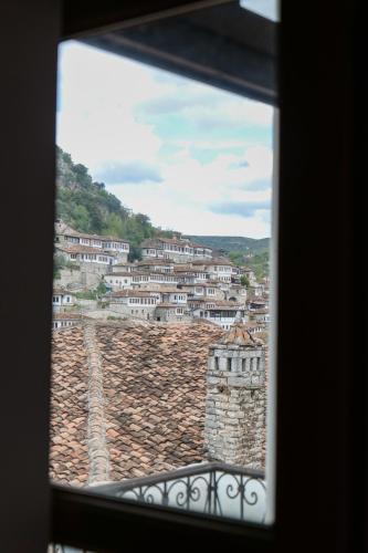 a view of a city from a window at Hotel Gorica - UNESCO quarter in Berat