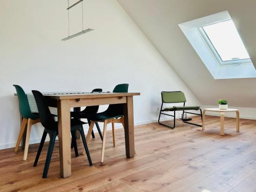 a dining room with a table and chairs at Ruheoase - Premium Suite in Karlsruhe