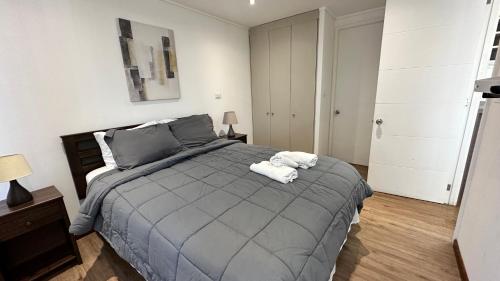Ένα ή περισσότερα κρεβάτια σε δωμάτιο στο Apart Hotel Castellon 176