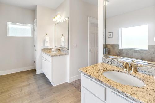 a bathroom with two sinks and a large mirror at Arborgate Gate Away At 7971 Double Gate Dr By Pkrm in Pensacola