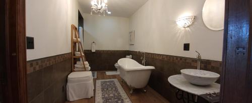 a bathroom with a sink and a toilet in it at Downtown Lake Geneva Home! Walk 2 Everything! in Lake Geneva
