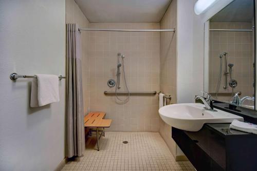 a bathroom with a sink and a shower at Motel 6-Douglas, AZ in Douglas