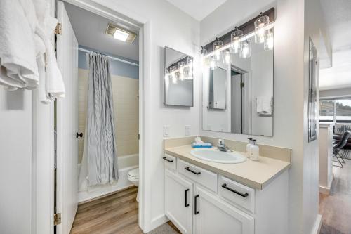 a bathroom with a sink and a toilet and a mirror at 2401 Pitchfork in Jackson