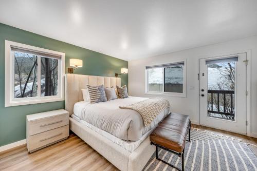 a bedroom with a bed and two windows at 2401 Pitchfork in Jackson