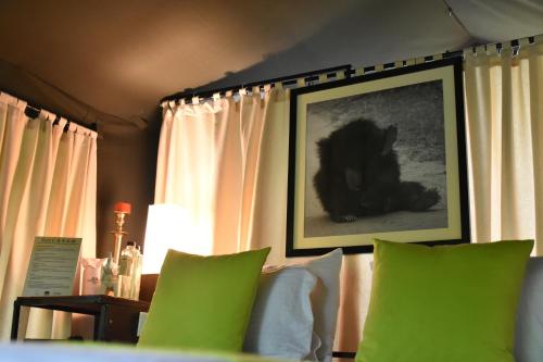 a room with a picture of a dog on the wall at Mahoora Yala - by Eco Team in Yala