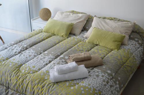 En eller flere senge i et værelse på Apartamento Ocio