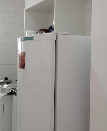 two refrigerators standing next to each other in a kitchen at Apartamento aconchegante in Ribeirão Preto