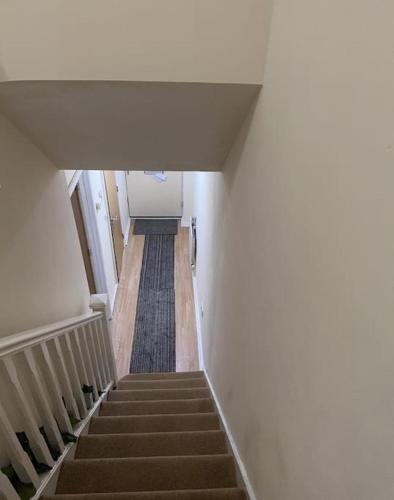 a view of a staircase in a building at Rooms 7 minutes from Etihad in Manchester