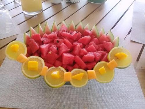 a plate of fruit with a train on it at Stunning beachfront house w/ private pool. in Zihuatanejo