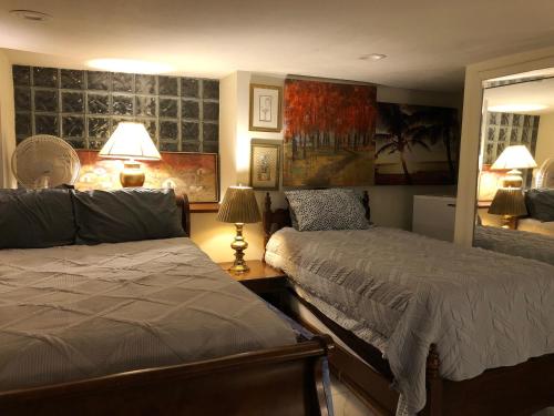 a bedroom with two beds next to a window at Highland Park Pittsburgh in Pittsburgh