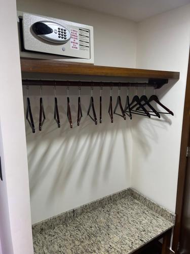 a row of knives hanging on a shelf in a room at La Mansión del Faro in Tecolutla