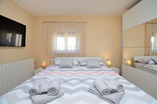 Ένα ή περισσότερα κρεβάτια σε δωμάτιο στο Villa Daris