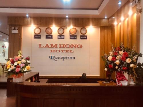 a large sign on the wall of a law enforcement courtroom at Lam Hong Hotel in Xuân Ðài