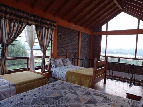 Ένα ή περισσότερα κρεβάτια σε δωμάτιο στο Casa De Los Colores